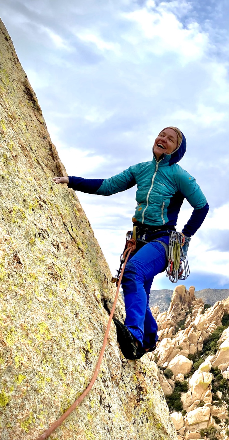 Marta laughing on a granite climb in the desert