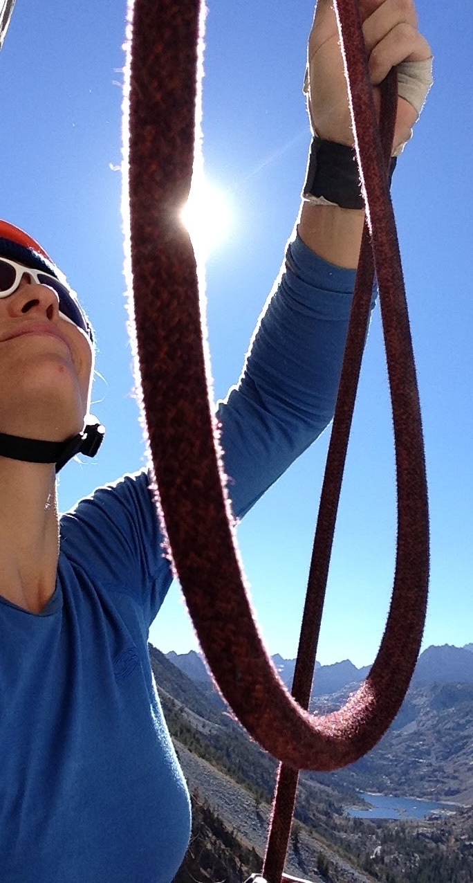 Looking up the rope toward the anchor, a Sierra lake far below